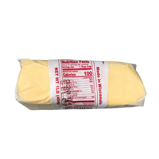 A 1 lb package of Wisconsin Sharp Cheddar Cheese,  with a white paper label displaying nutritional facts and 'Made in Wisconsin'.